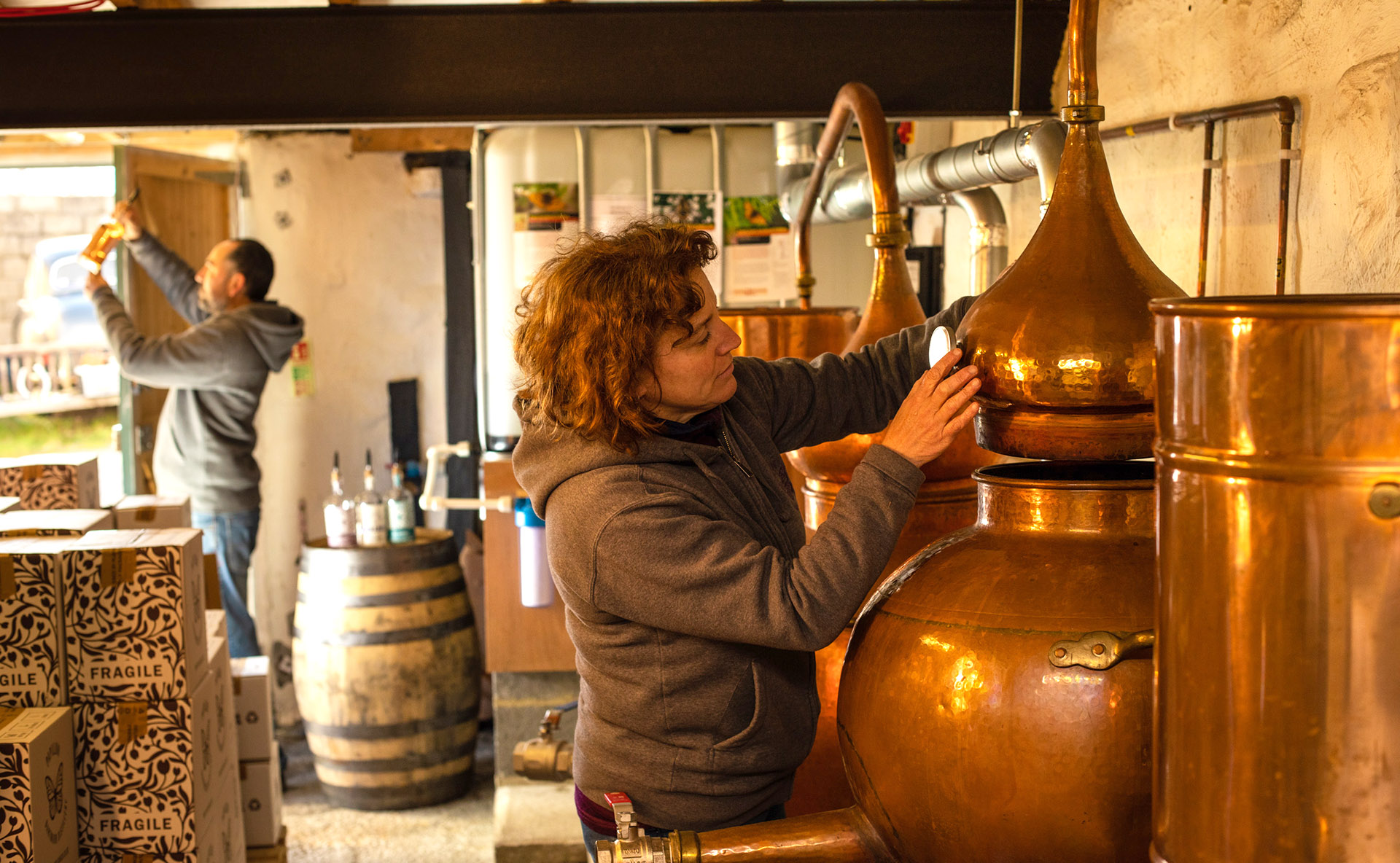 Adam and Claire of Papillon Gin, preparing a batch from copper stills. Using traditional gin botanicals from Dartmoor